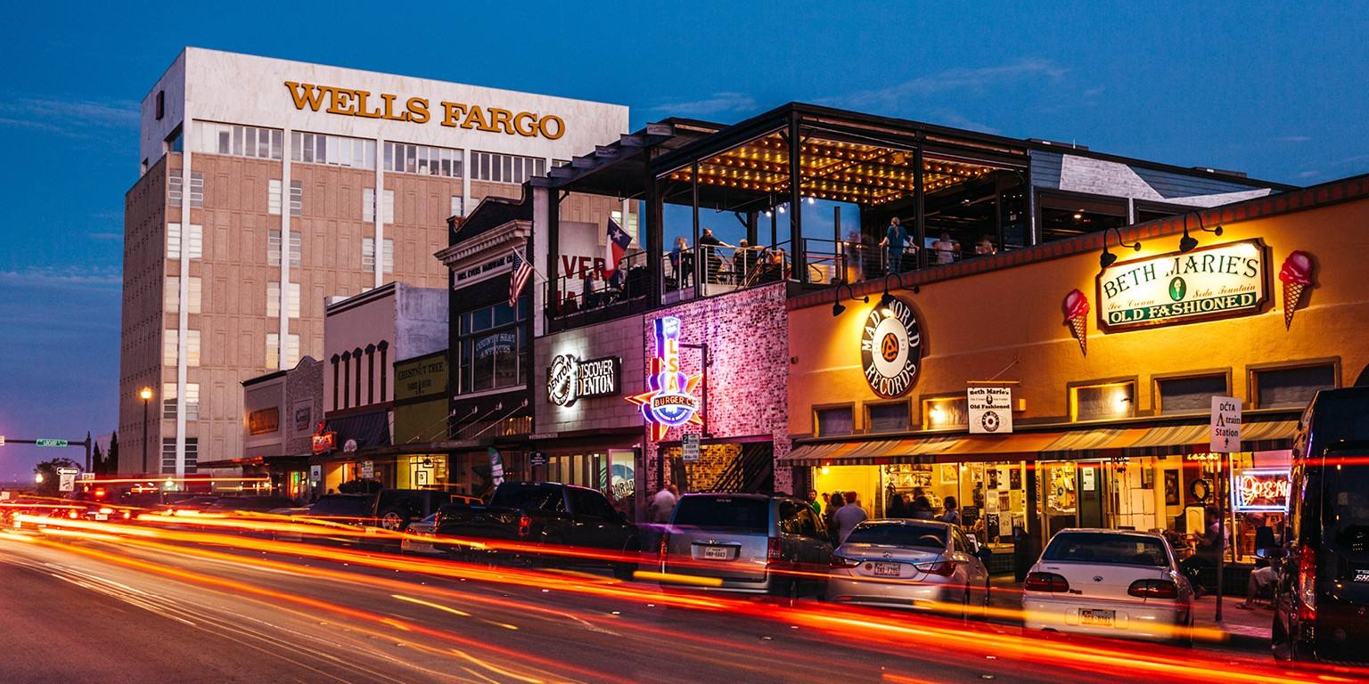 Denton Texas downtown square at night — NTI Technologies serves DFW